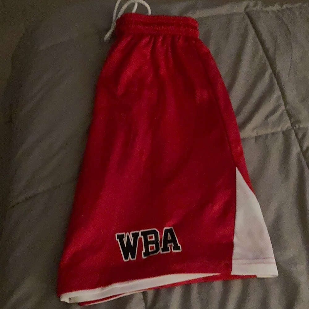 Two pairs of Women’s basketball shorts size small reversible red and white